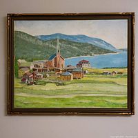 Full view of the framed oil painting depicting a landscape village scene.