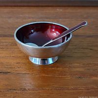 View of sterling silver Danish dish with red enamel bowl and matching spoon inside the dish, showing size and condition.