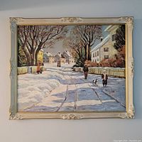 Framed oil on board painting showing a winter street scene with people and dog in a snow-covered village.
