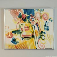 Framed abstract watercolour painting with colorful swirls and brushstrokes on display.