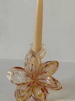 Top view of the Murano flower candleholder showing the petal design with amber and clear glass blending.