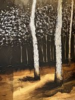 Close-up of textured birch tree trunks with silvery paint highlights and dark shadowed ground.