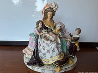 Front view of the figurine on round base