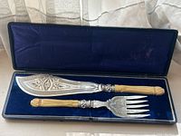 Full view of knife and fork in original case