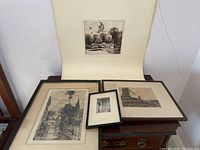 Overview of four prints including three framed and one mat-mounted.