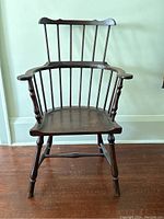 Full front view of the antique walnut Windsor chair showing overall form, finish and proportions.