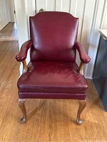 Front view showing overall armchair condition, upholstery and leg style