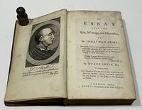 Photo of book opened showing engraved portrait and title page with full title and publishing details.