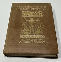 Front cover showing brown hardcover with gold embossed text and illustration 'Siegfried & The Twilight of the Gods Illustrated by Arthur Rackham'.