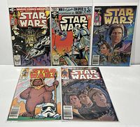 Five Marvel Star Wars comics laid side by side, showing all front covers, bagged and boarded