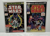 Both Marvel Star Wars comics issues #1 and #2 shown together, front covers visible in protective bags.