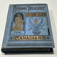 Front angled view of blue hardcover book with 'Home Treasury of Song for Canadians' title in gold and black lettering along with decorative imagery.