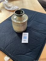 Full view of pottery butter cooler, showing embossed 'Butter' lettering and bulbous neck stopper.