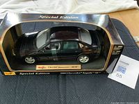 Black 2004 Chevrolet Impala SS model car in sealed original Maisto Special Edition box.