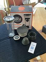 Photo showing the full set of components for the CoolGear BRU cold brew coffee maker, including filters and brewing jar with lid.
