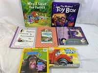 Front view of seven children's books, showing cover art and titles.