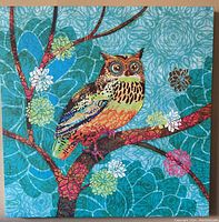 Full front view of the square owl canvas artwork mounted on a beige wall.