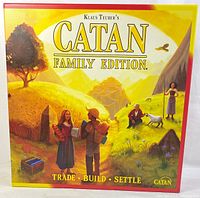 Front view of the Catan Family Edition board game box with artwork of settlers in a pastoral setting.