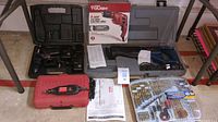 Photo shows the lot contents including Hyper Tough electric drill in box, Ryobi drill in gray case, Craftsman cordless drill red case, and 88-piece drill bit set.