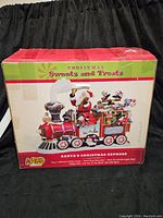 Box of Cracker Barrel Christmas Sweets and Treats Santa's Christmas Express train figurine, showing packaging and branding.