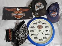 Full view of all items including sealed sign, two hats, two bandanas, and wall clock.