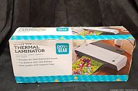 Photo of the Pen+Gear Letter Size Thermal Laminator box showing brand, product name, features, and size compatibility.