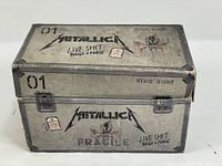 Photo of the outer box showing Metallica Live Shit: Binge & Purge design, box marked '01', with wear and dents visible