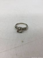 Front view of ring showing center and shoulder stones