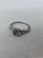 Front angle view showing round CZ and bead-design shoulders