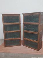 Two assembled bookcases side by side against wall