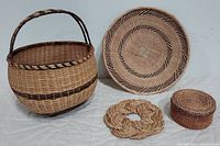 Photo of 3 hand woven baskets and Manila rope sailor knot wreath trivet arranged on a white surface, showing details of textures and colors.