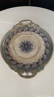 Full view of the antique ceramic oval tray with detailed floral design and two handles