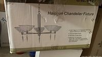 Box packaging front showing chandelier image, dimensions and details.