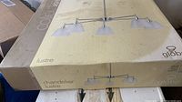 Box of Globe Electric Colje Aspen chandelier showing product image and branding.