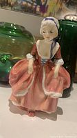 Front view of Royal Doulton HN 1905 'Goody Two Shoes' figurine showing detailed facial features and dress.