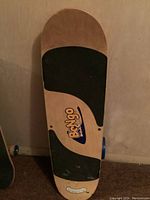 Top view of Bongo Board showing natural wood deck with black grip tape and Bongo logo.