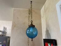 Full view of lamp hanging from ceiling