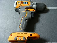 Left side view of RIDGID cordless drill showing sub compact body, textured grip, and drill chuck.