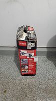 Original Toro Super Blower Vac box standing upright, displaying product details and images representing use and features.