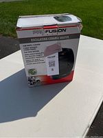 Front view of Profusion oscillating ceramic heater box with product details including 1500 watts, 2 heat settings, 5120 BTU, and oscillating function.