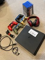 Overhead view of all included items: console, controllers, headset, games and cables