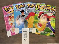 Set of four Pokémon Viz Comics 'The Electric Tale of Pikachu' volumes 1-4 featuring colorful covers in mint condition.