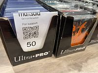 Two Ultra PRO top loader boxes front view, one labeled 50