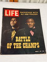 Front cover of the 1971 Life magazine showing Muhammad Ali and Joe Frazier with headline Battle of the Champs.