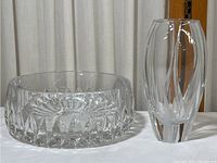 Crystal dish and vase set placed side by side, showing full shape and size ratio