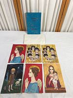 Top view showing 6 representative Keane Christmas cards with large-eyed children, praying girls, and mother and child.