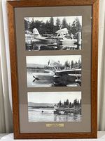 Photo of the full framed piece showing three black and white photos of seaplanes arranged vertically within a wooden frame.