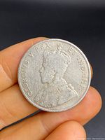 Obverse side of the Canadian 1911 silver 50 cent coin showing King George V profile and inscription.