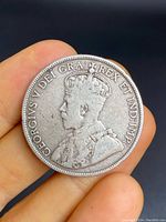 Obverse side of the 1917 Canadian 50 cent silver coin showing King George V profile with inscription.
