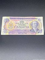Front side of the Canadian $10 bill showing the portrait, coat of arms, and serial numbers